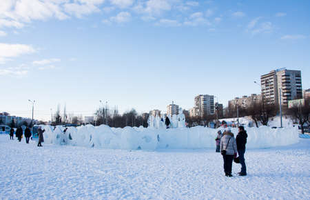 PERM, Russia, February, 06.2016: adults with children in an icy town on the Esplanade,  Lenina Streetのeditorial素材