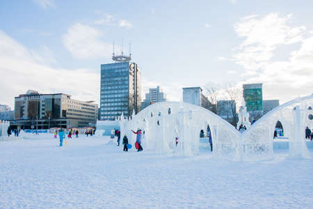 PERM, Russia, February, 06.2016: adults with children in an icy town on the Esplanade,  Lenina Streetのeditorial素材