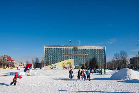 PERM, Russia, February, 06.2016: adults with children in an icy town on the Esplanade,  Lenina Streetのeditorial素材