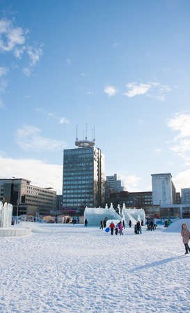 PERM, Russia, February, 06.2016: adults with children in an icy town on the Esplanade,  Lenina Streetのeditorial素材