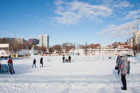 PERM, Russia, February, 06.2016: adults with children in an icy town on the Esplanade,  Lenina Streetのeditorial素材