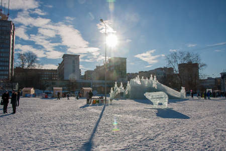 PERM, Russia, February, 06.2016: adults with children in an icy town on the Esplanade, 
 Lenina Streetのeditorial素材