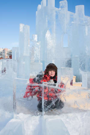 PERM, RUSSIA, Feb, 06.2016: Boy with an ice sculpture, urban esplanade, Lenin Street