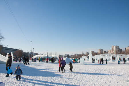 PERM, Russia, February, 06.2016: adults with children in an icy town on the Esplanade,  Lenina Streetのeditorial素材