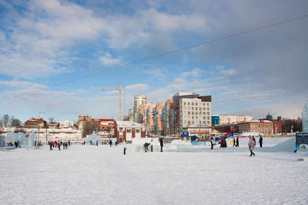 PERM, Russia, February, 06.2016: adults with children in an icy town on the Esplanade,  Lenina Streetのeditorial素材