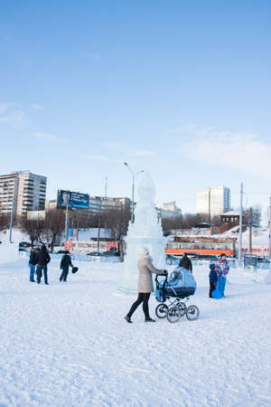 PERM, Russia, February, 06.2016: adults with children in an icy town on the Esplanade,  Lenina Streetのeditorial素材