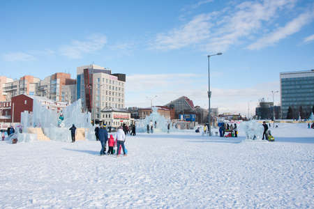 PERM, Russia, February, 06.2016: adults with children in an icy town on the Esplanade,  Lenina Streetのeditorial素材