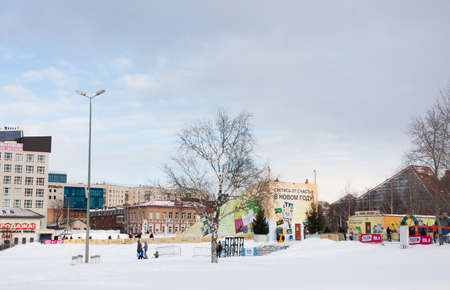 PERM, Russia, February, 06.2016: adults with children in an icy town on the Esplanade,  Lenina Streetのeditorial素材