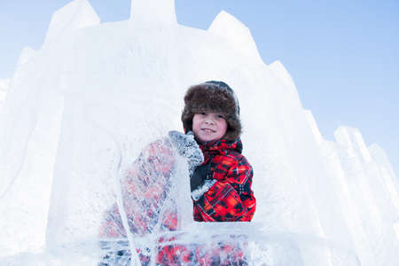 PERM, RUSSIA, Feb, 06.2016: Boy with an ice sculpture, urban esplanade, Lenin Street