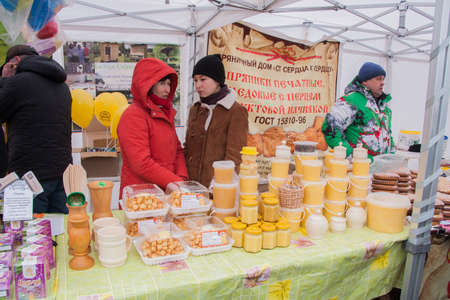 PERM, RUSSIA - March 13, 2016: Trade honey at the celebration of Carnivalのeditorial素材