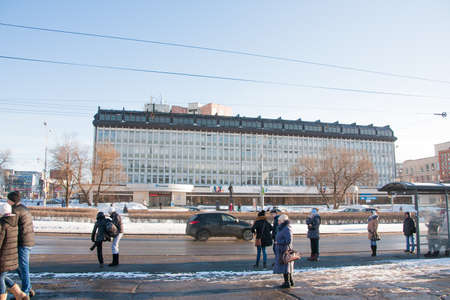 PERM, RUSSIA - March 13, 2016: People stand at a bus stop, Lenin Streetのeditorial素材