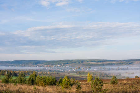 Perm, Russia - Fog over the village early in the morningの写真素材