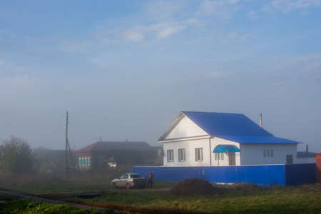 Perm, Russia - September 24.2016: Fog over the village early in the morningのeditorial素材