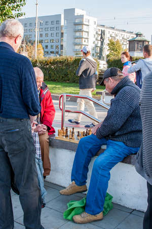 Ekaterinburg, Russia - September 24.2016: Men play chess on quay in warm autumn dayのeditorial素材