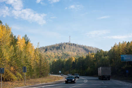 Perm, Russia - September 24.2016: Mountain in the distance and the road with carsのeditorial素材