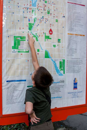 Yekaterinburg, Russia - September 24.2016: Boy near the city map on the streetのeditorial素材