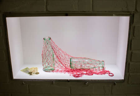 Ekaterinburg, Russia - September 24.2016: Vladimir Vysotsky's Museum, glass bottles in a string-bag and the Soviet moneyのeditorial素材