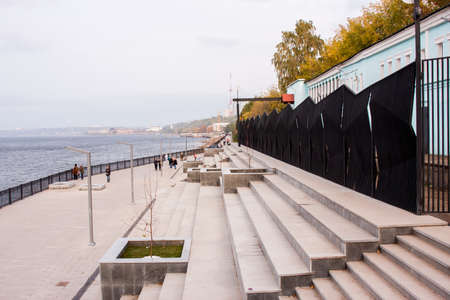 Perm, Russia - September 28,2016: People walk on quay of the river in autumn dayのeditorial素材