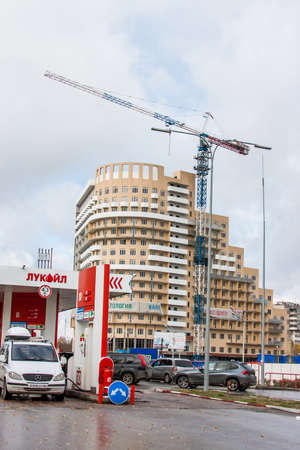 Ekaterinburg, Russia - October 02.2016: Construction of the new house and a gasoline station ' Lukoil 'のeditorial素材