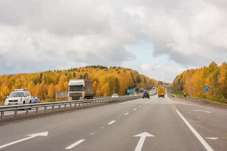 Ekaterinburg, Russia - October 02.2016: Traffic of cars on a line in an autumn sunny dayのeditorial素材