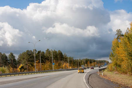 Ekaterinburg, Russia - October 02.2016: Traffic of cars on a line in an autumn sunny dayのeditorial素材
