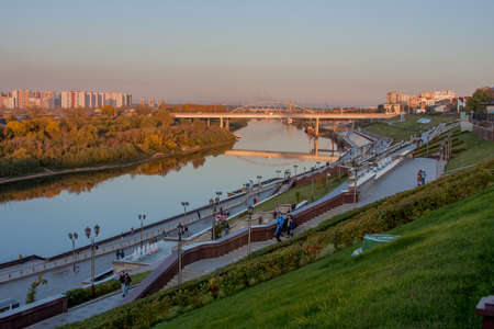 Tyumen, Russia - October 01.2016: Beautiful evening landscape with a bridge at sunset, University embankment riverのeditorial素材
