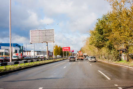 Ekaterinburg, Russia - October 02.2016: Traffic of cars on a line with the blue cloudy skyのeditorial素材
