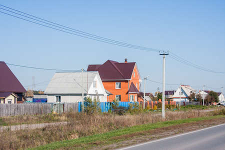 Tyumen, Russia - October 01.2016: Rural landscape and road disappearing into the distanceのeditorial素材