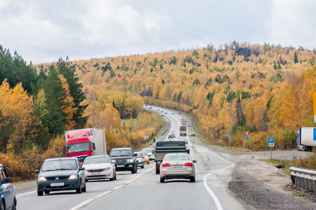 Ekaterinburg, Russia - October 02.2016: Traffic of cars on a line in an autumn sunny dayのeditorial素材