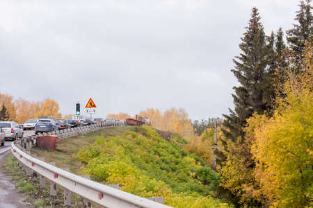 Yekaterinburg, Russia - October 02.2016: Autumn Landscape with a traffic jam on the road
