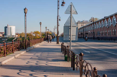 Tyumen, Russia - October 01.2016: Beautiful autumn city landscape, people walking down the avenueのeditorial素材