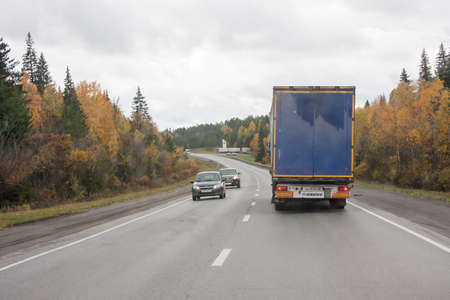 Revda, Russia - October 02.2016: Traffic of cars on a line in an autumn sunny dayのeditorial素材
