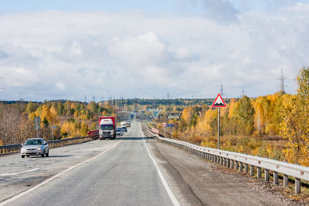 Revda, Russia - October 02.2016: Traffic of cars on a line in an autumn sunny dayのeditorial素材