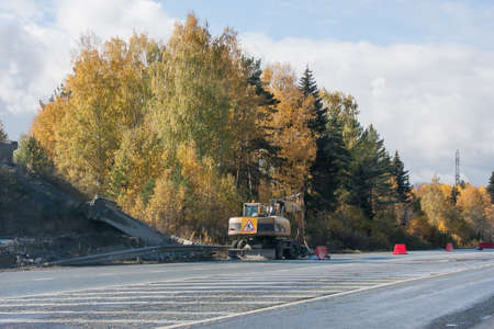 Revda, Russia - October 02.2016: Excavator working on road repair workのeditorial素材