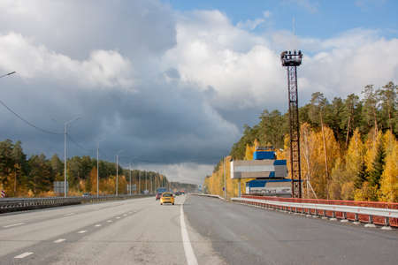 Ekaterinburg, Russia - October 02.2016: Traffic of cars on a line in an autumn sunny dayのeditorial素材