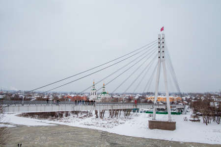 Tyumen, Russia - November 05.2016: Winter landscape with frozen river and the Bridge of Loversのeditorial素材