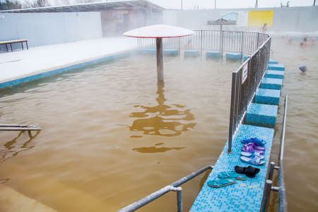 Tyumen, Russia - November 05.2016: People in pool with hot mineral water in winter, a thermal source ' Soviet 'のeditorial素材