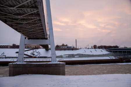 Tyumen, Russia - November 05.2016: Winter landscape at sunset with a bridge Lovers and river embankmentのeditorial素材