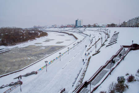 Tyumen, Russia - November 05.2016: Winter landscape with frozen river and the University Embankmentのeditorial素材