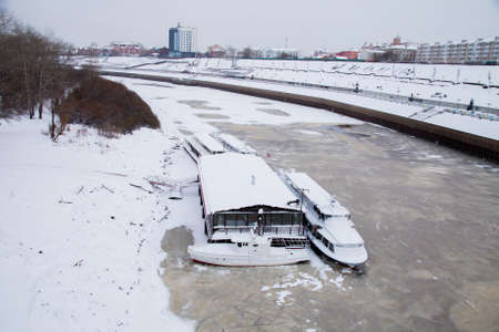 Tyumen, Russia - November 05.2016: Walking boats on quay of the river in the winter eveningのeditorial素材