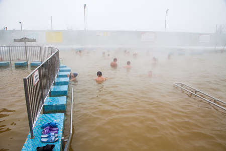 Tyumen, Russia - November 05.2016: People in pool with hot mineral water in winter, a thermal source ' Soviet 'のeditorial素材