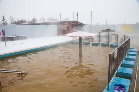 Tyumen, Russia - November 05.2016: People in pool with hot mineral water in winter, a thermal source ' Soviet 'のeditorial素材