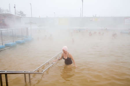 Tyumen, Russia - November 05.2016: People in pool with hot mineral water in winter, a thermal source ' Soviet 'のeditorial素材