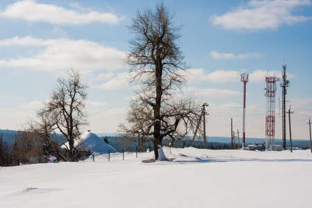 Winter landscape with a wooden house in Perm Krai, Russiaの写真素材