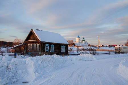 Sverdlovsk Region, Russia - March 01.2017: Winter rural landscape in the village of Sloboda at sunsetのeditorial素材