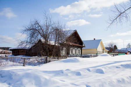 Winter rural landscape in the village of Sloboda, Sverdlovsk region, Russiaの写真素材
