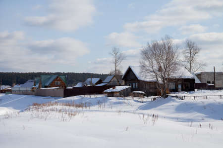 Winter rural landscape in the village of Sloboda, Sverdlovsk region, Russiaの写真素材