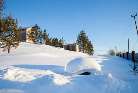 Winter rural landscape in the village of Kamenka, Sverdlovsk region, Russiaの写真素材