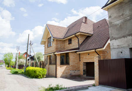Perm, Russia - New brick cottage on a summer sunny dayの写真素材