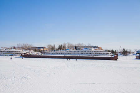 Perm, Russia - March 11.2017: Ships and barges on the shipyard in the backwater of the Kama River in winterのeditorial素材